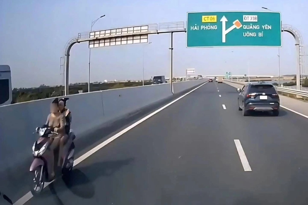 Hai cô gái đi xe máy ngược chiều trên đường cao tốc - 1